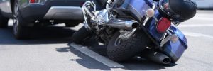 Crashed motorcycle and suv