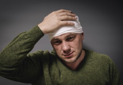 Man with a head bandage