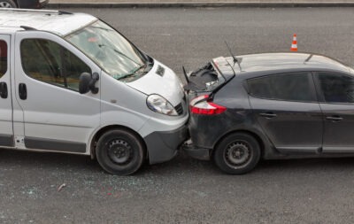 Mini van crashing into compact car scaled