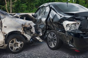 Silver car crashed into a black car