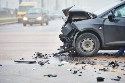 Smashed up black car