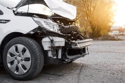 White car with crashed front end