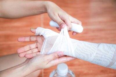 Woman getting bandage on her arm