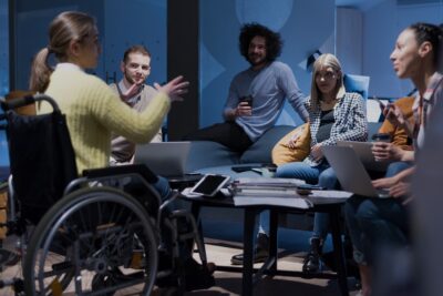 Woman in a wheelchair in a meeting