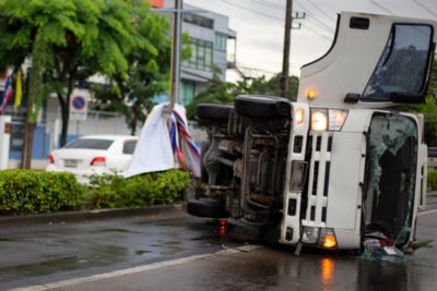 Bus overturned on slippery road scaled