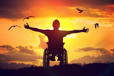 Handicapped man at sunset