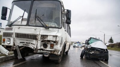 Smashed bus and car