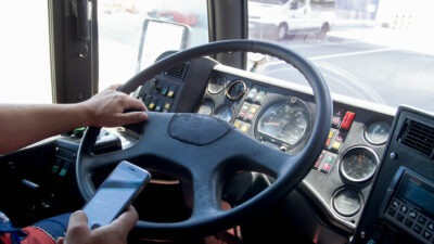 Bus driver texting while driving scaled