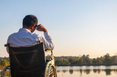 Man working outside in a wheelchair scaled