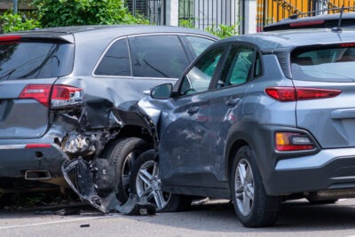 Two silver cars crashing scaled