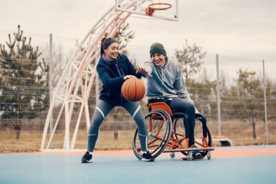 Boy in wheelchair playing basketball