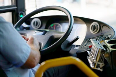 Bus driver at the wheel scaled