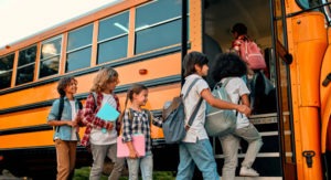 Children getting on a bus