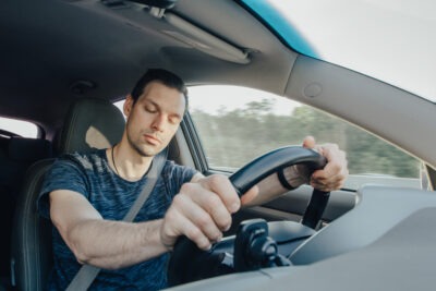 Drunk driver falling asleep at the wheel scaled