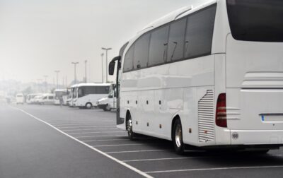 White tour bus parked