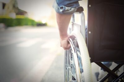 Close up on mans hand on wheelchair