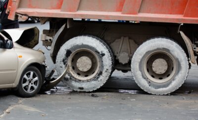 Garbage truck in collision with car