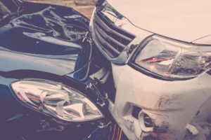 Truck and sedan in a crash