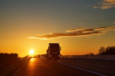 Truck coming down the road ominously scaled