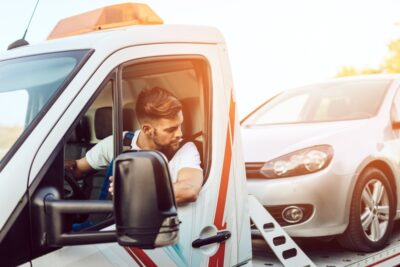 Truck driver being rear ended by a sedan