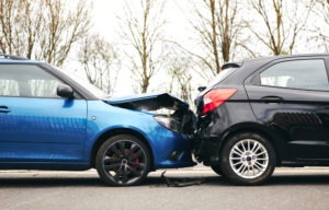 Blue car rear ending black one