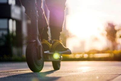 Close up on person riding a scooter