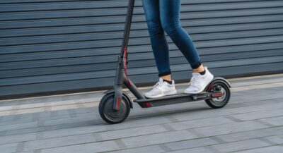 Girl riding electric scooter