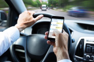 Man texting behind the wheel