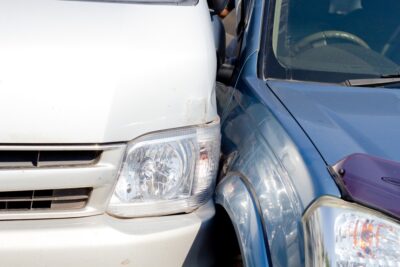 White and blue cars in a sideswipe accident