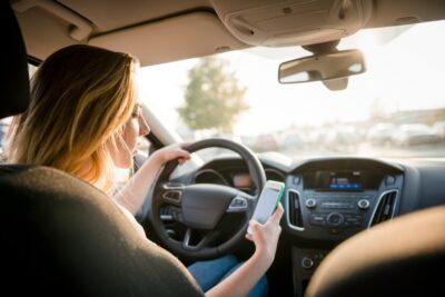 Woman texting while driving