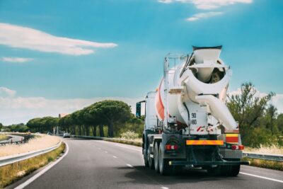 Cement truck driving down the road