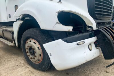 Delivery truck with broken fender