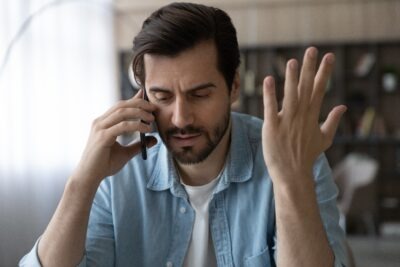 Man arguing with insurance agent scaled