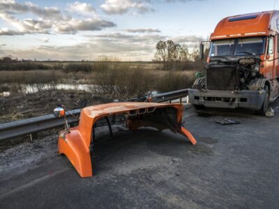 Orange tractor trailer with hood off