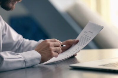 Lawyer looking over all legal papers scaled