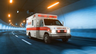 Ambulance riding through a tunnel scaled