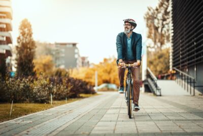 Man cycling down the road