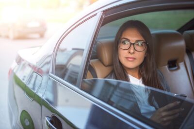 Female passenger in a car