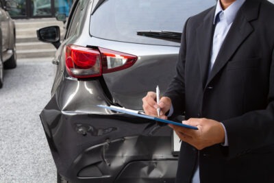 Insurance agent at accident scene scaled