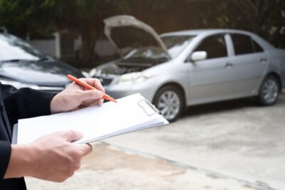 Insurance officer agent working on crash scaled