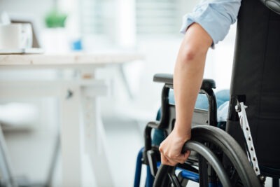 Close up on mans arm in wheelchair scaled