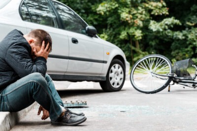 Distressed bike rider after a crash scaled