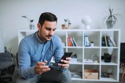 Man checking his incoming calls scaled