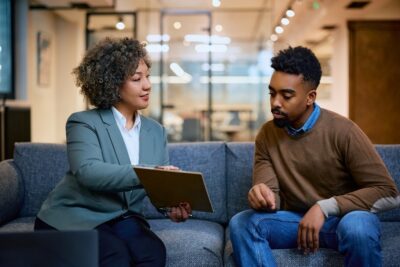 Insurance agent going over a policy with a client