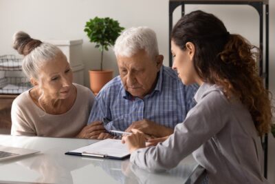 Lawyer meeting with elderly clients