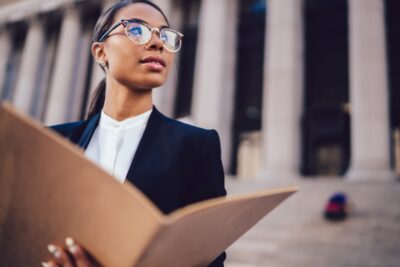 Black female lawyer outside courthouse