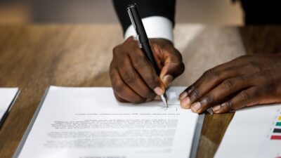 Black lawyer filling out paperwork