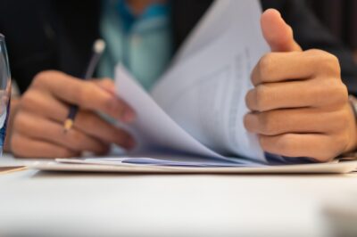 Lawyer flipping through legal docs