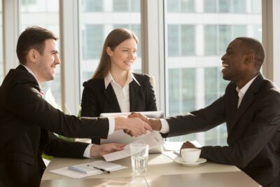 People shaking hands with an insurance agent 1