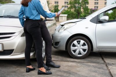 Insurance adjusters reviewing an overtaking car accident